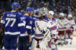 New York Rangers goaltender Igor Shesterkin (31) congratulates Tampa Bay Lightning right wing Corey Perry (10) and defenseman Victor Hedman (77) after the Lightning defeated the New York Rangers during Game 6 of the NHL hockey Stanley Cup playoffs Eastern Conference finals