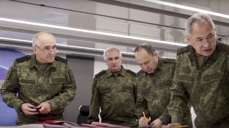 In this image taken from video released by Russian Defense Ministry Press Service on Sunday, June 26, 2022, Russian Defense Minister Sergei Shoigu, right, speaks to Russian high level officers while inspecting the Russian troops participating in a special military operation in Ukraine. ()