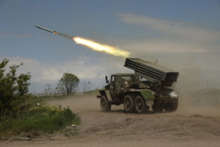 FILE - A Donetsk People's Republic militia's multiple rocket launcher fires from its position not far from Panteleimonivka, in territory under the government of the Donetsk People's Republic, eastern Ukraine, Saturday, May 28, 2022. Day after day, Russia is pounding the Donbas region of Ukraine with relentless artillery and air raids, making slow but steady progress to seize the industrial heartland of its neighbor. With the conflict now in its fourth month, it’s a high-stakes campaign that could dictate the course of the entire war. ()