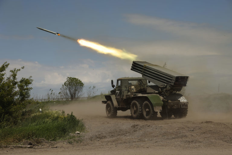 FILE - A Donetsk People's Republic militia's multiple rocket launcher fires from its position not far from Panteleimonivka, in territory under the government of the Donetsk People's Republic, eastern Ukraine, Saturday, May 28, 2022. Day after day, Russia is pounding the Donbas region of Ukraine with relentless artillery and air raids, making slow but steady progress to seize the industrial heartland of its neighbor. With the conflict now in its fourth month, it’s a high-stakes campaign that could dictate the course of the entire war. ()