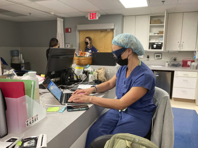 Dr. Rebecca Taub updates files between performing abortions at the Trust Women clinic in Wichita, Kan., Friday, June 24, 2022. "Performing abortions today of all days definitely carries more meaning to it," Taub said. "You feel the importance of this work. It is really a sad day in the clinic." ()
