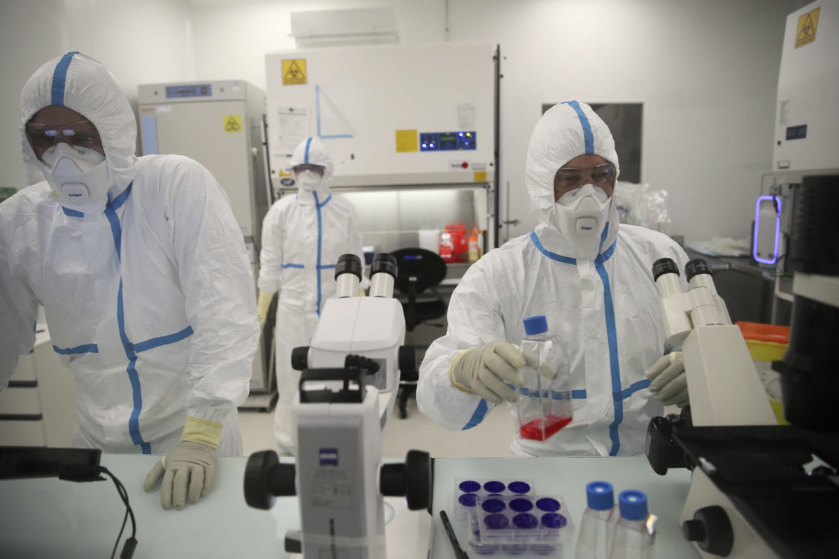 FILE - Laboratory technicians work at the Valneva headquarters in Saint-Herblain, western France, on Feb.3, 2021. The European Medicines Agency said it is recommending the authorization of the coronavirus vaccine made by French pharmaceutical Valneva, making it the sixth shot given the green light in Europe. ()