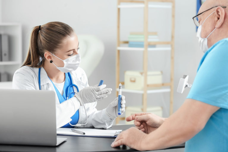 Senior diabetic man visiting doctor in clinic