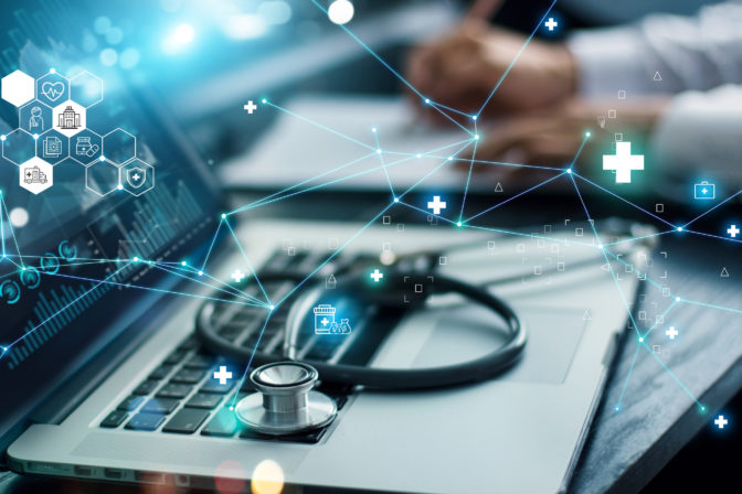 Healthcare business graph data and growth, Insurance Healthcare. Doctor analyzing medical of business report and medical examination with network connection on laptop screen.