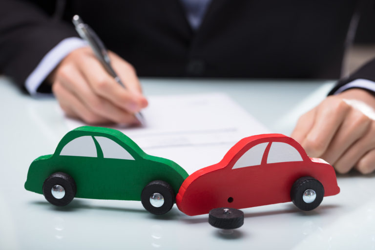 Close up Of Red And Green Car