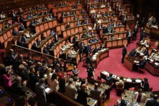 Lawmakers attend at the Senate, in Rome, Thursday, July 14, 2022, before voting a bill on various economic measures. The stability of Italian Premier Mario Draghi's coalition government is at risk because 5-Star lawmakers say they will not participate in a confidence vote in Parliament. ()
