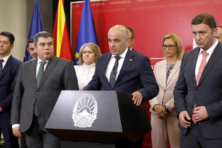 North Macedonia's Prime Minister Dimitar Kovacevski, center, speaks for the media in presence of Vice Prime Minister Began Maricic, front left, Foreign Minister Bujar Osmani front right and other cabinet ministers in the Government building in Skopje, North Macedonia, on Saturday, July 16, 2022. Leftist North Macedonia's cabinet has officially accepted French proposal on an urgent meeting later on Saturday. Prime minister Dimitar Kovacevski said that North Macedonia will start accession talks with EU on July 19. ()