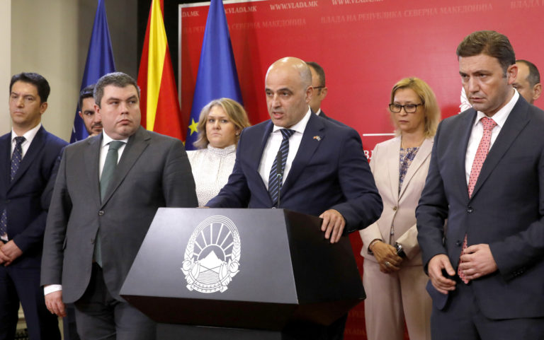 North Macedonia's Prime Minister Dimitar Kovacevski, center, speaks for the media in presence of Vice Prime Minister Began Maricic, front left, Foreign Minister Bujar Osmani front right and other cabinet ministers in the Government building in Skopje, North Macedonia, on Saturday, July 16, 2022. Leftist North Macedonia's cabinet has officially accepted French proposal on an urgent meeting later on Saturday. Prime minister Dimitar Kovacevski said that North Macedonia will start accession talks with EU on July 19. ()