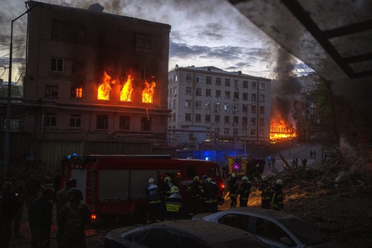 FILE - Emergency services work in the area following an explosion in Kyiv, Ukraine, on April 28, 2022, as Russia struck the Ukrainian capital of Kyiv shortly after a meeting between President Volodymyr Zelenskyy and U.N. Secretary-General António Guterres. After more than four months of ferocious fighting, Russia claimed full control over one of the two provinces in Ukraine’s eastern industrial heartland. The critical question now is whether Russia can muster enough strength for a new offensive to complete its seizure of the Donbas and make gains elsewhere in Ukraine.