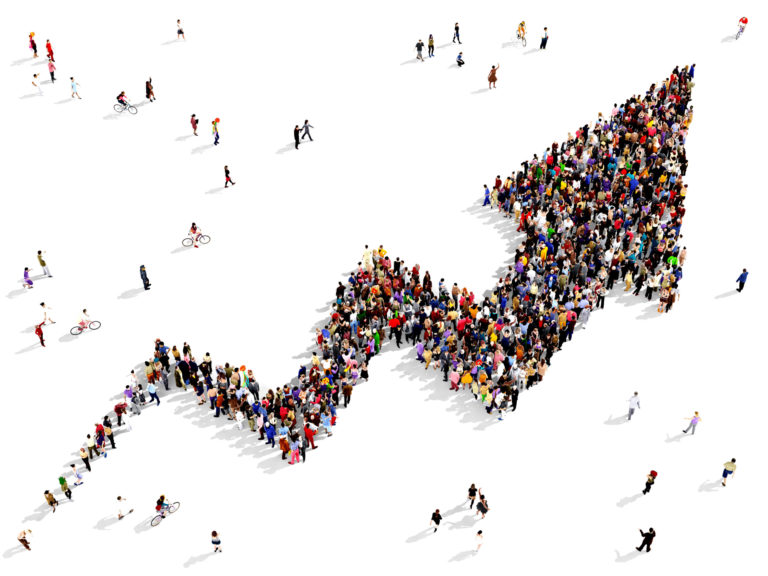 Large,Group,Of,People,Gathered,Together,In,The,Shape,Of