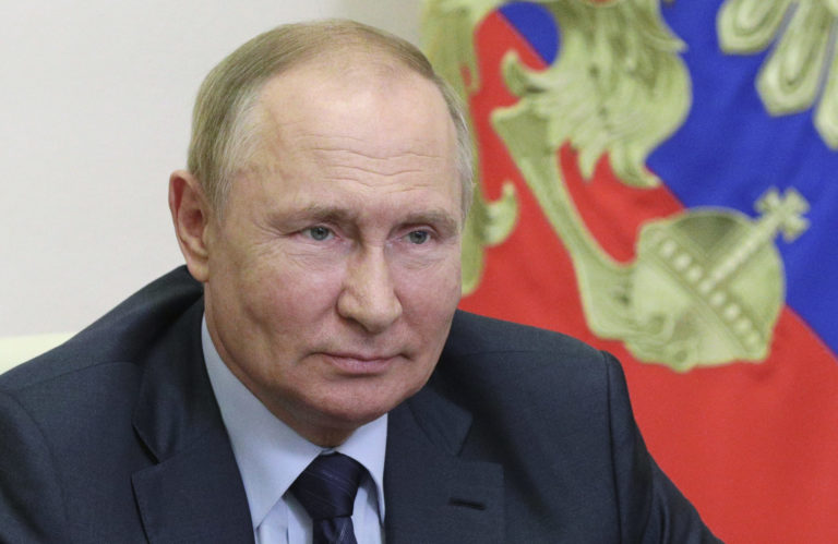 Russian President Vladimir Putin attends a meeting via a video conference link at the Novo-Ogaryovo state residence, outside Moscow, Russia