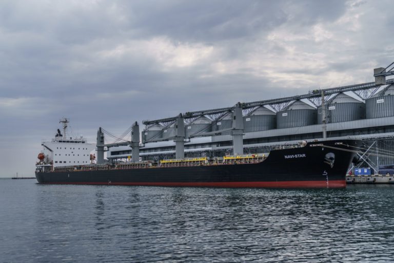 FILE - The ship Navi-Star sits full of grain since Russia's invasion of Ukraine began five months ago as it waits to sail from the Odesa Sea Port, in Odesa, Ukraine, Friday, July 29, 2022. Ukraine is steadily exporting grains from its Black Sea ports under a wartime deal brokered last month, but the agreement has also proven helpful to Russian farmers and the country's cornerstone agriculture industry.