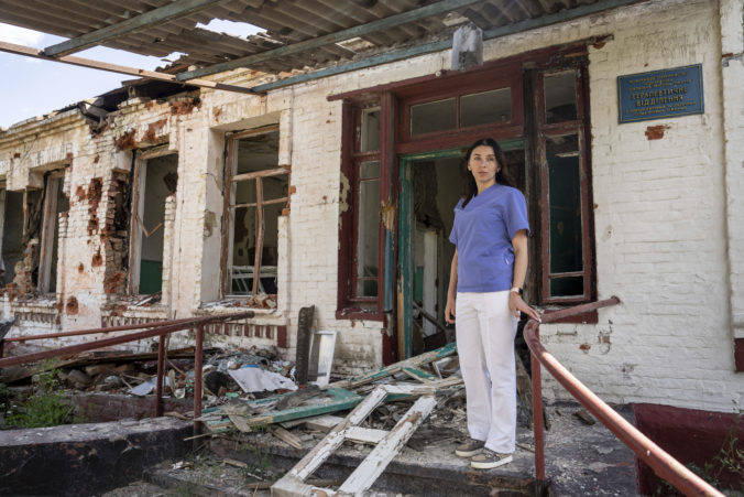 Dr. Ilona Butova stands in front of the therapy department which was destroyed after a Russia attack on the hospital in Zolochiv, Kharkiv region, Ukraine, Sunday, July 31, 2022. Ukraine's health care system already was struggling due to corruption, mismanagement and the COVID-19 pandemic. But the war with Russia has only made things worse, with facilities damaged or destroyed, medical staff relocating to safer places and many drugs unavailable or in short supply