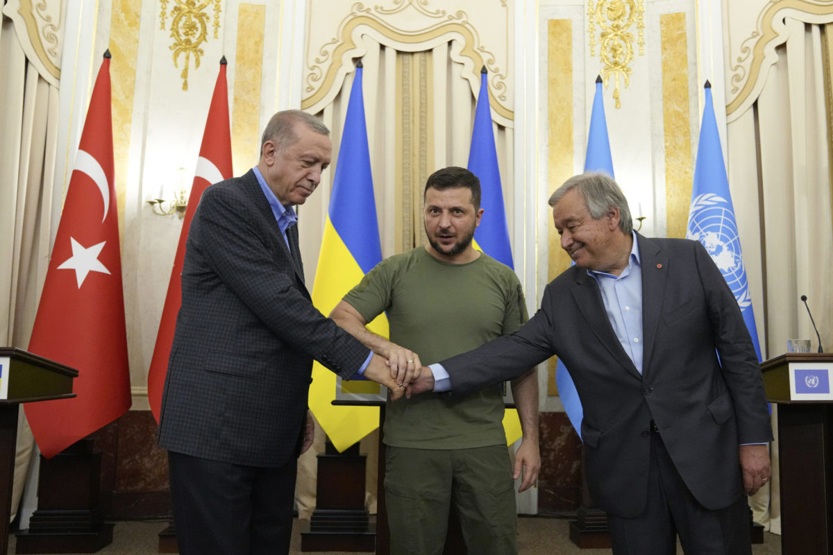Ukrainian President Volodymyr Zelenskyy, center, Turkish President Recep Tayyip Erdogan, left, and United Nations Secretary General Antonio Guterres shake hands after their meeting in Lviv, Ukraine,