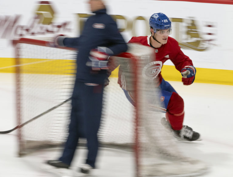 Juraj Slafkovsky makes a turn around the net at the Montreal Canadiens NHL hockey training camp in Brossard, Quebec