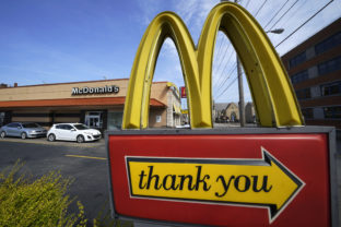 FILE - An exit sign is shown at a McDonald's restaurant in Pittsburgh on Saturday, April 23, 2022. McDonald’s reported better-than-expected sales in the third quarter, Thursday, Oct. 27, 2022, as it charged higher prices and drew in customers with its Camp McDonald’s promotion