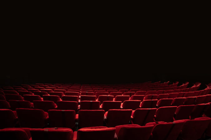 Theater seats and stage with black isolated stage