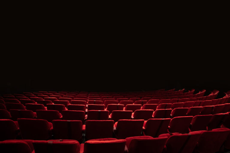 Theater seats and stage with black isolated stage