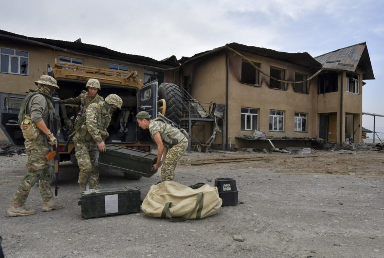 Kyrgyz mine clearing experts prepare to work to find and defuse mines after fighting between Kyrgyzstan and Tajikistan in Ak-Sai village about 950km (593 miles) southwest of Bishkek the capital of Kyrgyzstan, Tuesday, Sept. 20, 2022. Fighting started last Wednesday, for no obvious or publicly announced reason