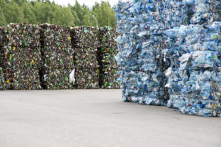 Minsk, Belarus  June 6, 2019 A pile of extruded plastic bottles at a garbage collection plant. Sorting and recycling plastic
