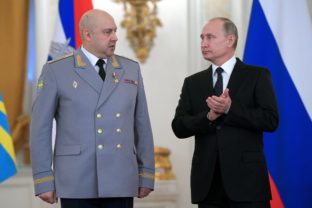 FILE - Russian President Vladimir Putin, right, applauds Col. Gen. Sergei Surovikin during an awards ceremony for troops who fought in Syria, in the Kremlin, in Moscow, Russia, Thursday, Dec. 28, 2017. Russia's Defense Ministry announced that air force chief, Gen. Sergei Surovikin, would be the commander of all Russian troops fighting in Ukraine. The statement marked the first official appointment of a single commander for the entire Russian force in Ukraine