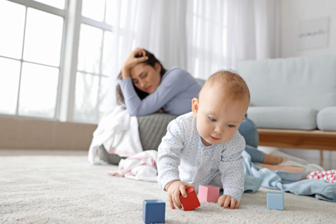 Cute,Baby,And,Young,Woman,Suffering,From,Postnatal,Depression,At