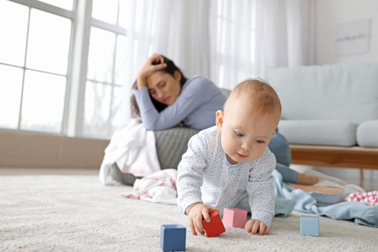 Cute,Baby,And,Young,Woman,Suffering,From,Postnatal,Depression,At