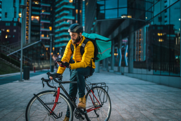 Food delivery, rider with bicycle delivering food