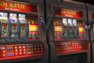 Slot machines row in a casino. Onliine casino and gambling concept background.
