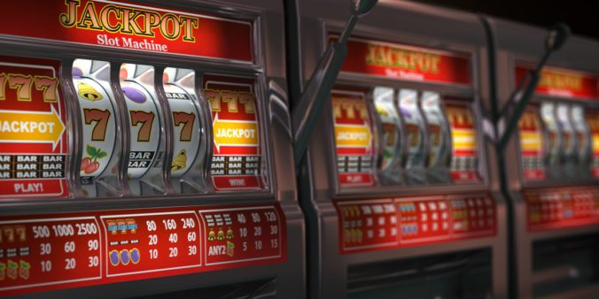 Slot machines row in a casino. Onliine casino and gambling concept background.