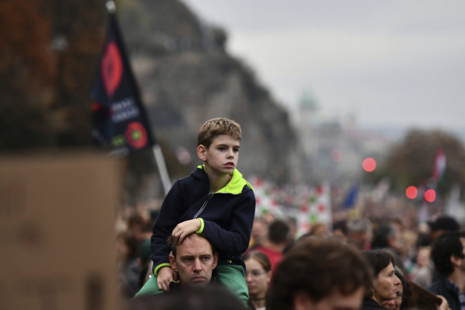 People gather to demonstrate in solidarity with students and teachers demanding higher wages and better working conditions, at Liberty Bridge, in Budapest, Hungary, Sunday, Oct. 23, 2022, on the national holiday of the 66th anniversary of the Hungarian anti-communist uprising of 1956.