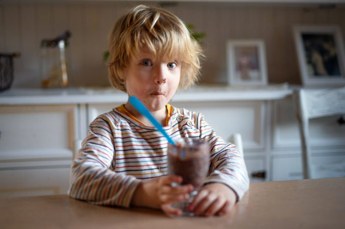 Small,Boy,With,Dirty,Mouth,Indoors,In,Kitchen,At,Home,