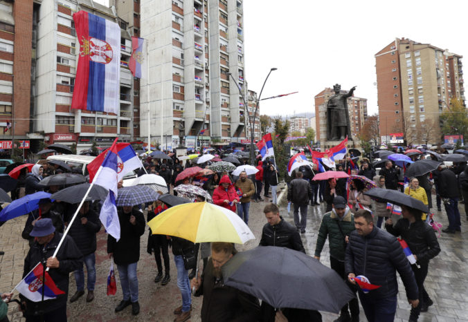 Kosovo Serbs wave Serbian flags during a protest in Mitrovica, Kosovo, Sunday, Nov. 6, 2022. Several thousand ethnic Serbs on Sunday rallied in Kosovo after a dispute over vehicle license plates triggered a Serb walkout from their jobs in Kosovo's institutions and heightened ongoing tensions stemming from a 1990s' conflict