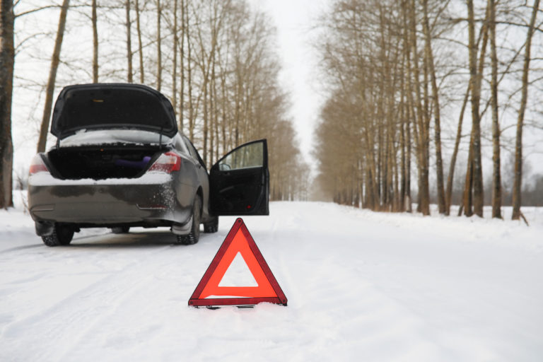 Man and car. Winter walk and car repair.