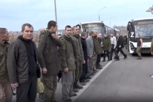 In this handout photo taken from video released by Russian Defense Ministry Press Service on Friday, Nov. 4, 2022, a group of Russian soldiers stand after being released in a prisoners swap in the Donetsk People's Republic, eastern Ukraine. The Russian Defense Ministry released video late Thursday, saying it showed Russian soldiers released as part of a prisoners swap. The ministry said in a statement that "107 Russian military personnel who were in captivity were returned" from the Kyiv-controlled territory.