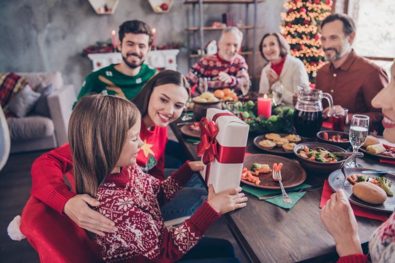 Portrait of attractive cheerful family meeting having fun eve advent party time congratulating at home indoors