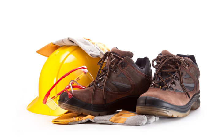 Goggles,,Boots,,Yellow,Hard,Hat,And,Gloves,On,A,White