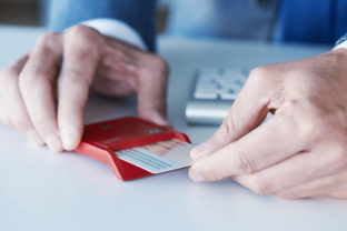 Man insearting an electronic identification in a reader