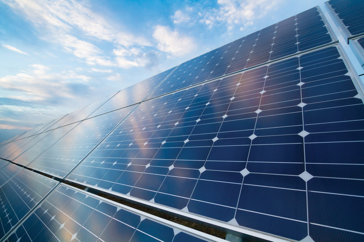 Photovoltaic,Modules,Reflect,Sunset,Light,And,Clouds