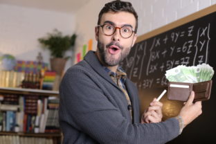 Successful teacher holding full wallet