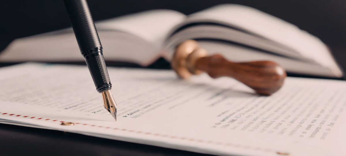 Agreement concept with fountain pen and documents