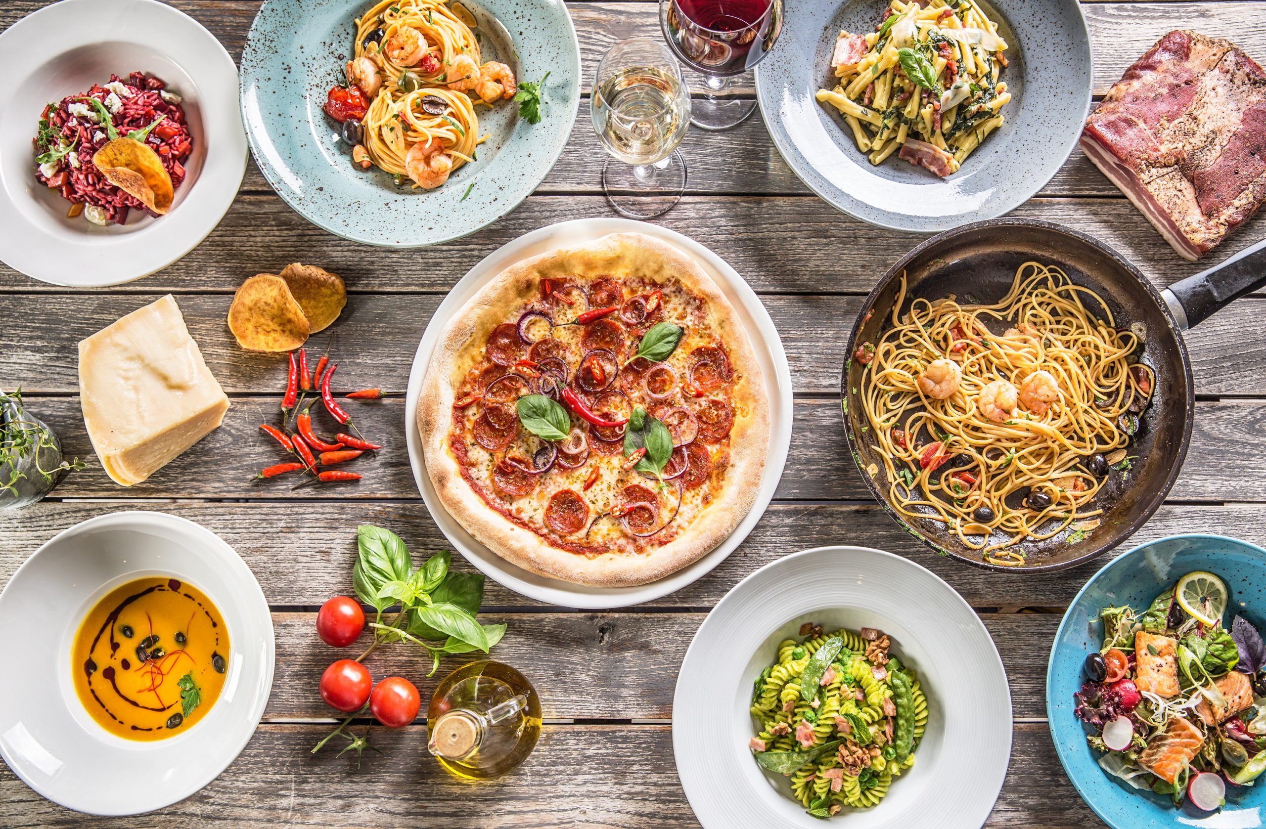 Top,Of,View,Full,Table,Of,Italian,Meals,On,Plates