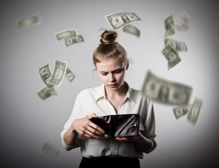 Worried,Slim,Woman,Is,Looking,In,A,Wallet.,Dollars,Are