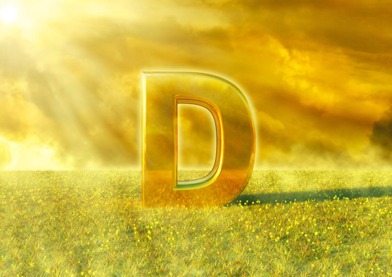 Vitamin D illuminated by the rays of the sun on grass. Sunlight is an excellent source of this nutrient that strengthens the immune system