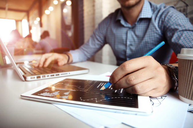 Business adviser analyzing financial figures denoting progress  of company
