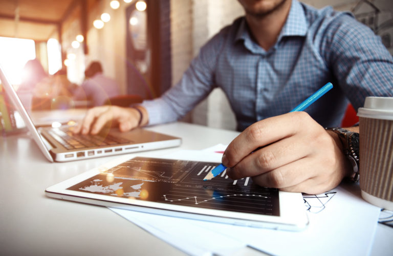 Business adviser analyzing financial figures denoting progress  of company