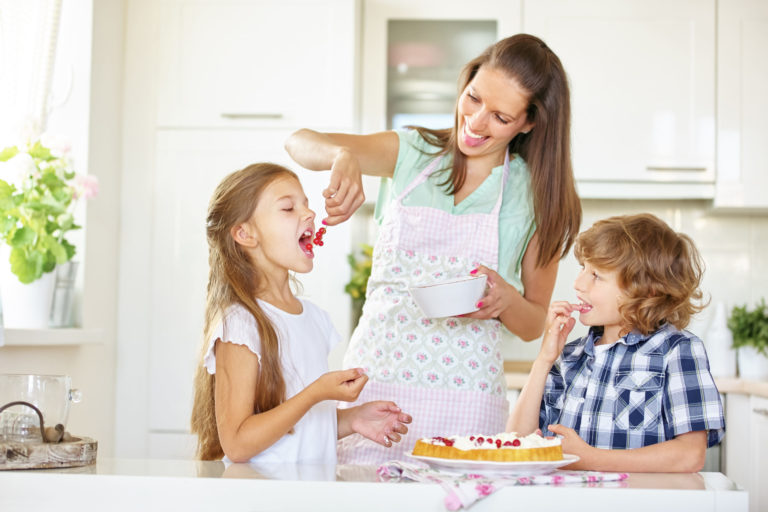 Mother,And,Children,Baking,Cake,Together,With,Red,Currants,In