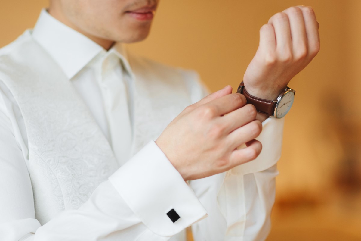 Businessman clock clothes, businessman checking time on his wrist watch. mens hand with a watch, watch on a man