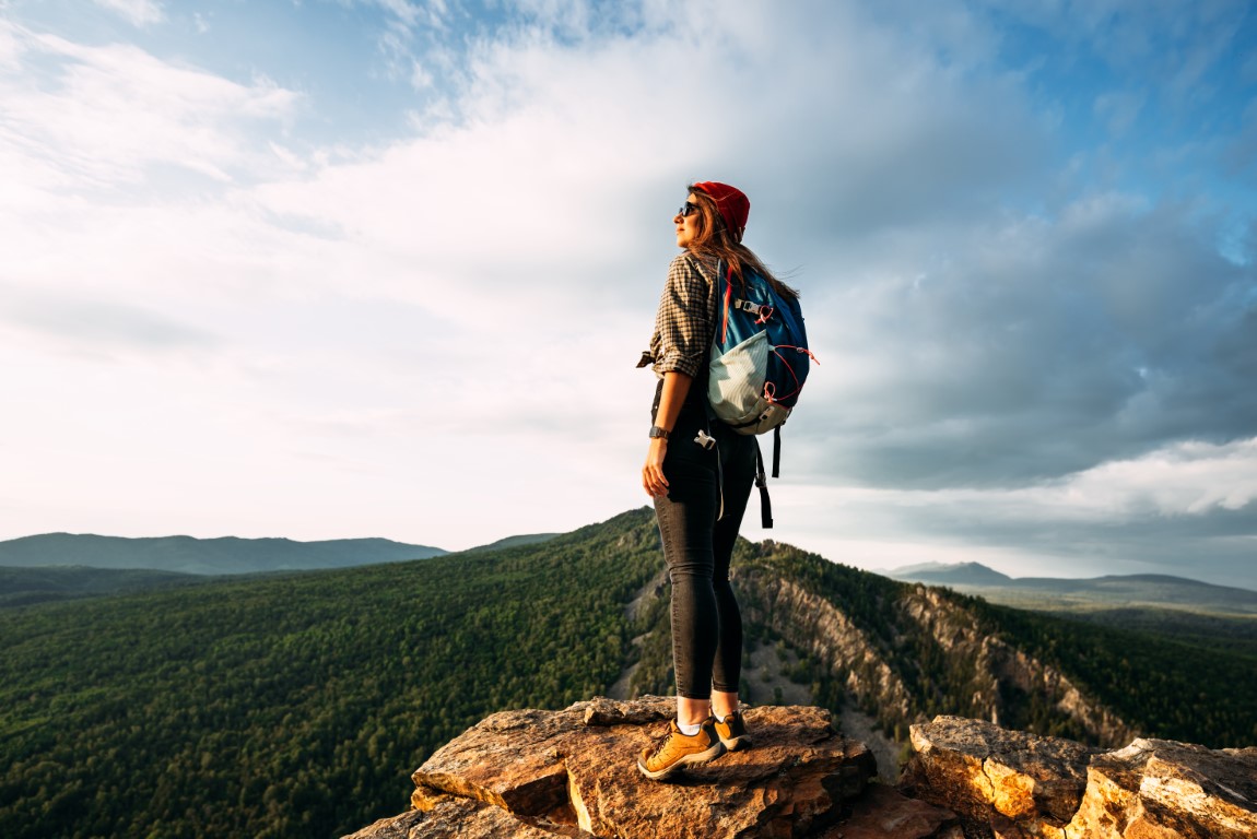 A woman meets the sunset in the mountains man tra 2022 01 21 20 44 12 utc.jpg