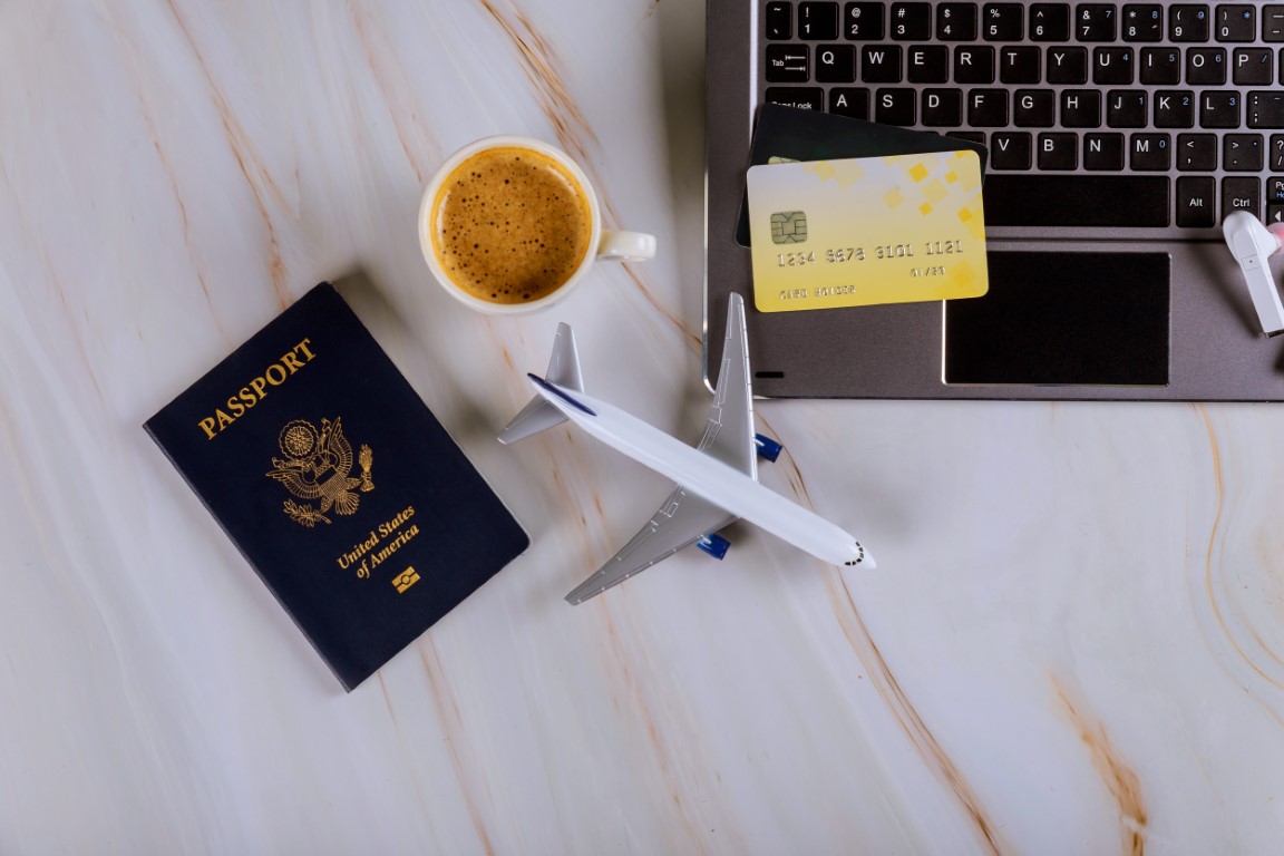 Book your flight with using a laptop for buying airline tickets on a credit card with USA passport